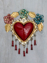 Corazón con pompones y flores