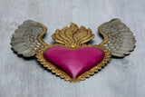 Corazón alado una flama con flores