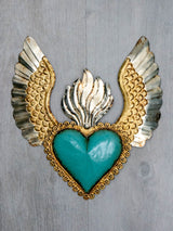 Corazón alado una flama con flores