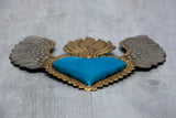 Corazón alado una flama con flores