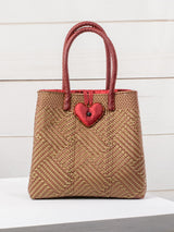 Bolsa artesanal corazón milagro mediana con pompón de flor