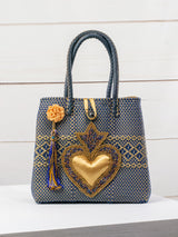 Bolsa artesanal corazón milagro mediana con pompón de flor