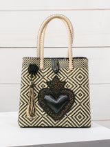 Bolsa artesanal corazón milagro mediana con pompón de flor
