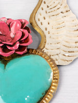 Winged heart with a flower